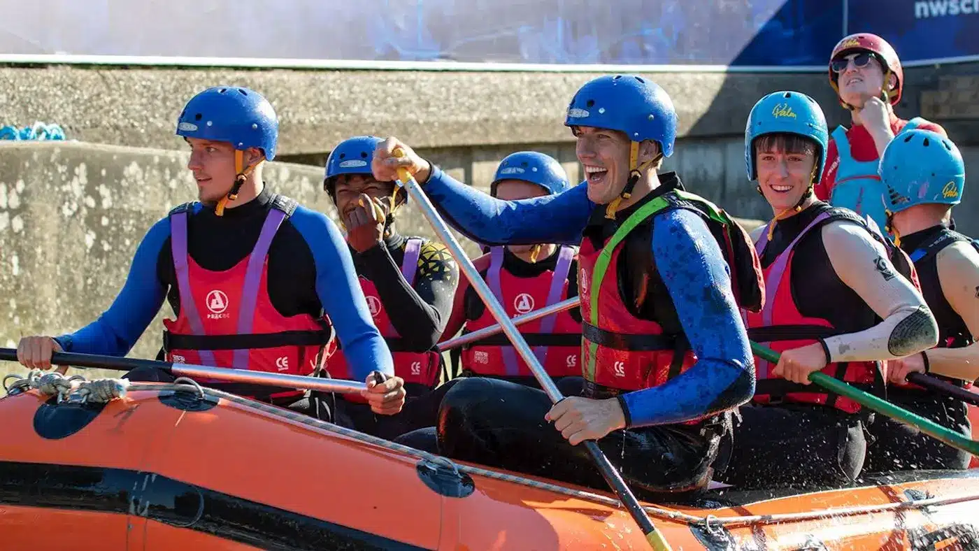 group of people rafting - H2QO Watersports