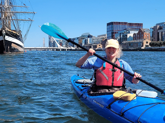 kayak with bridge behind