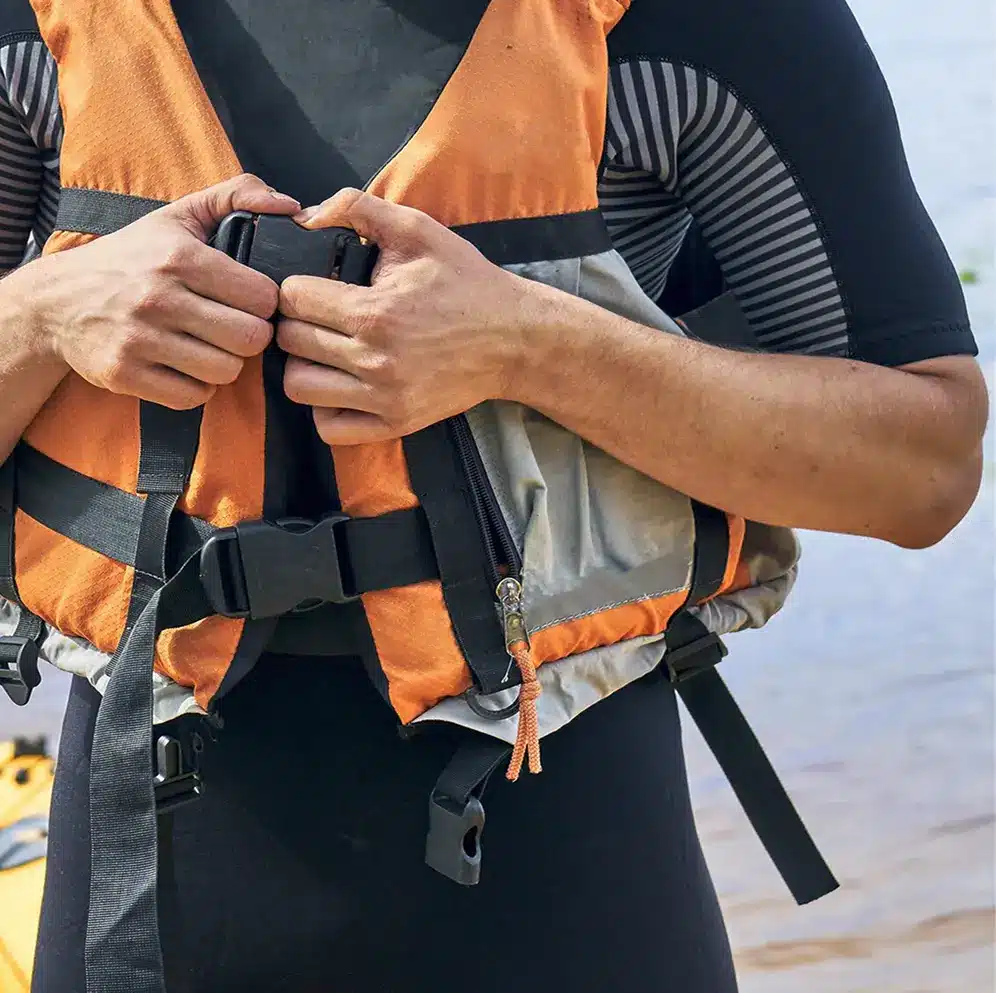 man with orange life jacket - H2QO WaterSports